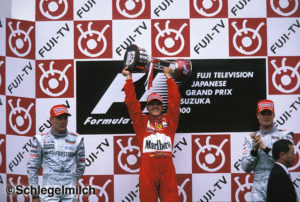 Michael Schumacher holding trophy