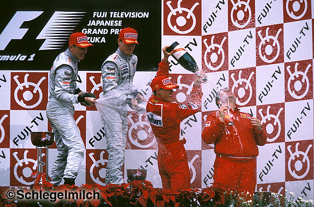Schumacher and McLaren drivers on podium