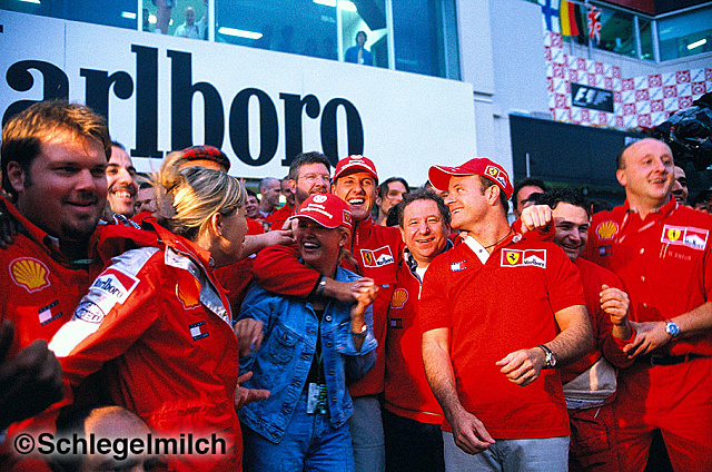 Schumacher with wife and team