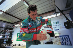 Michael Schumacher cleaning helmet