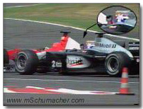 Coulthard makes hand motion to Schumacher
